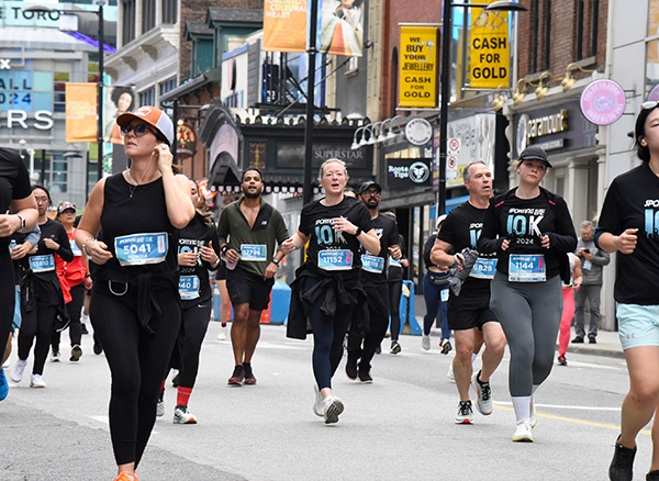 sl10k-toronto-run-day-1-2024 Sporting Life 10K 2024 Runners down Yonge St.