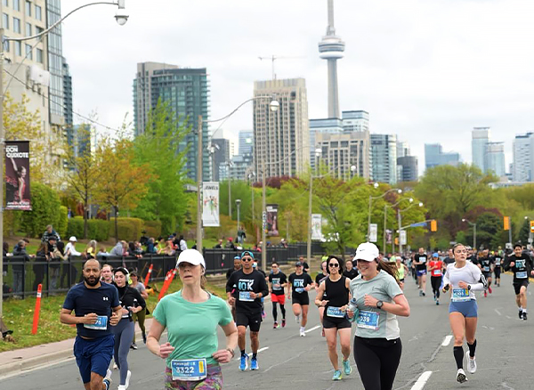 sl10k-toronto-run-day-3-2024 Sporting Life 10K 2024 Runners in front of the CN Tower